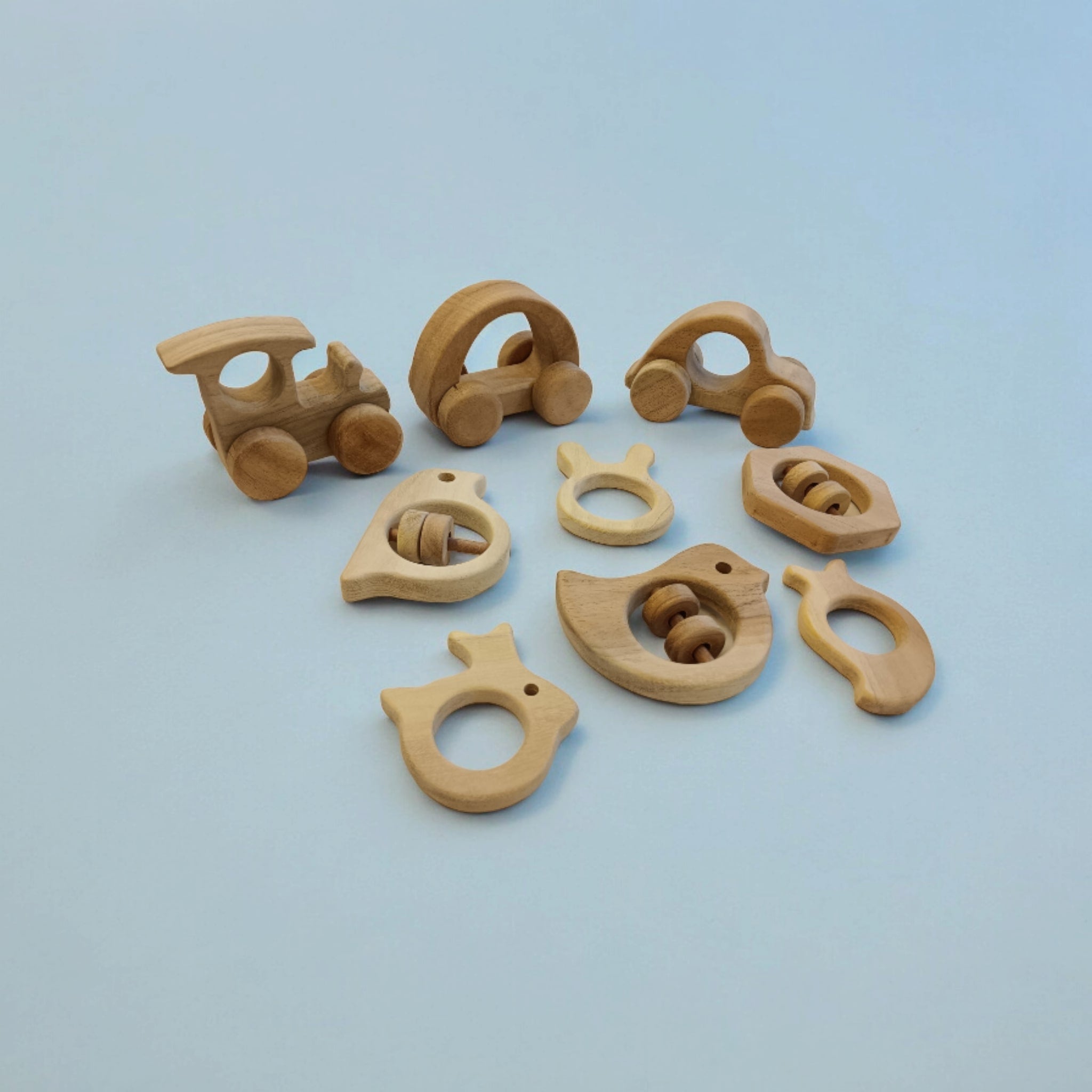 Pack of 9 Neem Wooden Baby Toys | Wheel, Rattle & Teether Set – Wooden Toys on Brown Living™. SKU: WRT_CR-HCR-TRN-DV-SPR-HXN-MNG-RBT-BNY. Img 5.