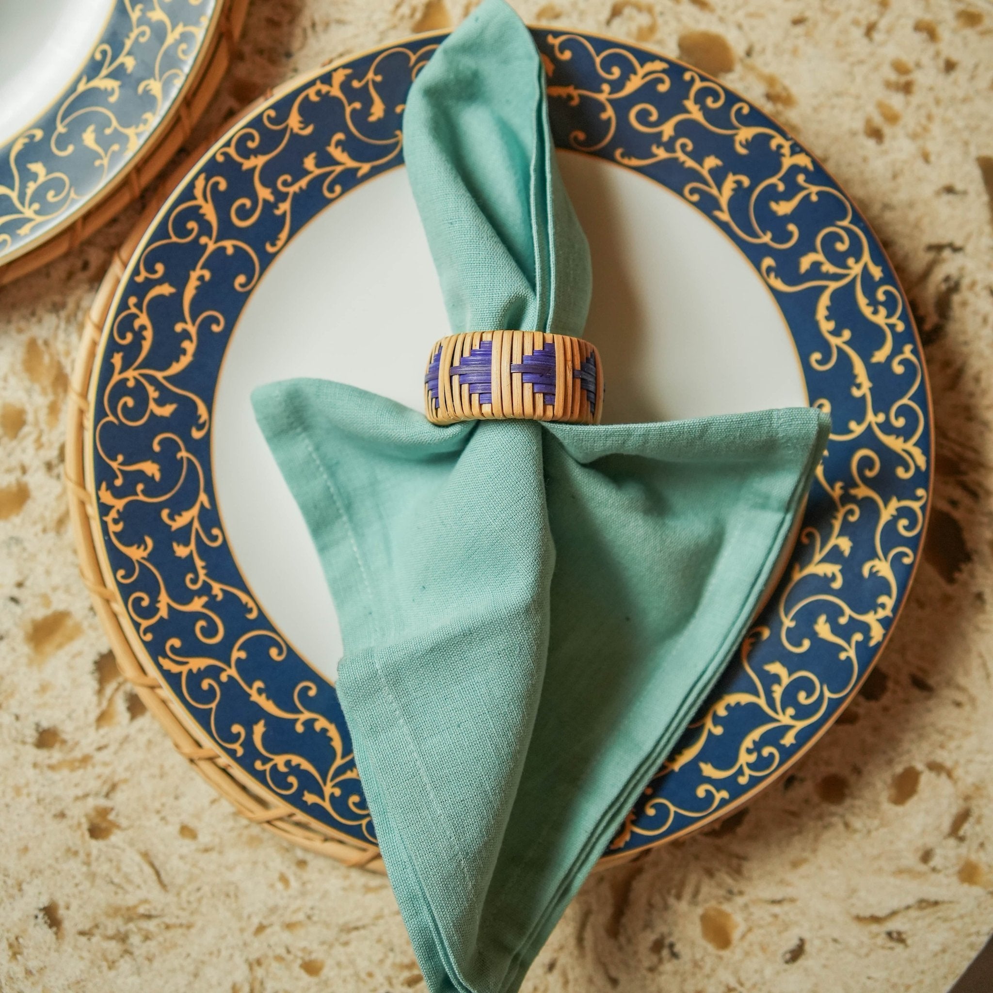 Rattan Indigo Napkin Rings - Set of 2 | Natural Fiber Table Accessories – Table Essentials by AJAARA available on Brown Living™. Pack Of 2 . SKU: SYMTA007. Img 1.