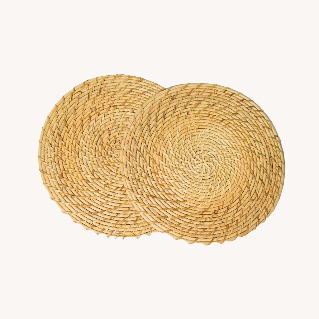 Rattan Trivets (Set of 2) | Handwoven, Heat - Resistant Table Mats – Table Linens by AJAARA available on Brown Living™. . SKU: SYMTA002. Img 2.