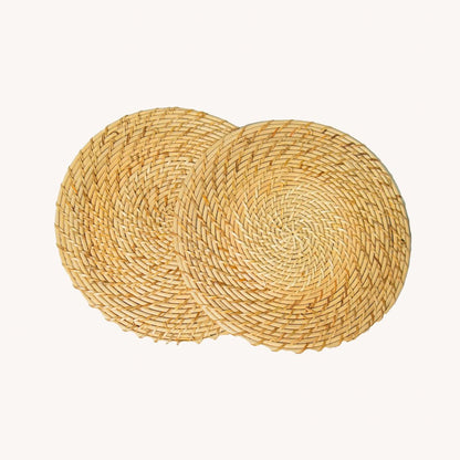 Rattan Trivets (Set of 2) | Handwoven, Heat - Resistant Table Mats – Table Linens by AJAARA available on Brown Living™. . SKU: SYMTA002. Img 2.
