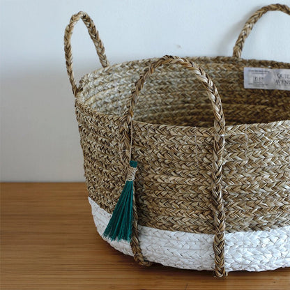 Seagrass Anthro Tassel Basket Green – Handwoven Eco Storage Basket – Home Decor on Brown Living™. SKU: AnthroTasselBasketGreenWhiteSmall. Img 5.