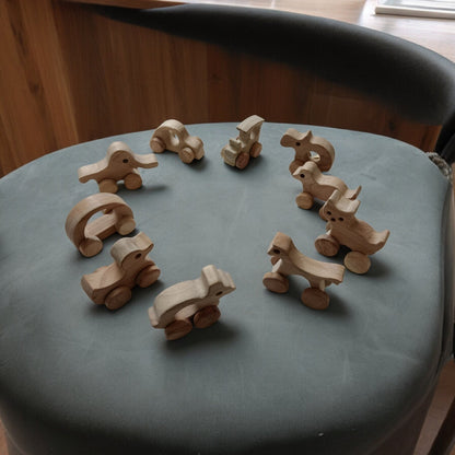 Set Of 10 Beautiful Push & Pull Toys For Toddlers – Toy Trains & Vehicles on Brown Living™. SKU: W_SET10. Img 1.