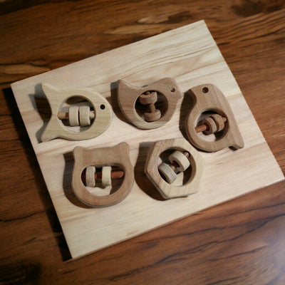 Soundmaking Rattles – Sparrow, Dove, Fish, Hippo & Hexagon Shapes – Baby Rattles on Brown Living™. SKU: R_SET5. Img 6.