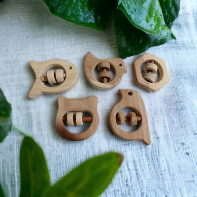 Soundmaking Rattles – Sparrow, Dove, Fish, Hippo & Hexagon Shapes – Baby Rattles on Brown Living™. SKU: R_SET5. Img 1.