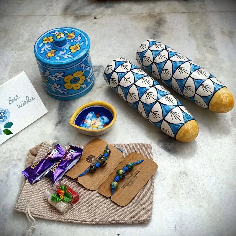 Sustainable Blue Pottery Luxury Rakhi Gift Hamper – Rakhi by Terracotta by Sachii available on Brown Living™. . SKU: SACHIIRLH003. Img 1.