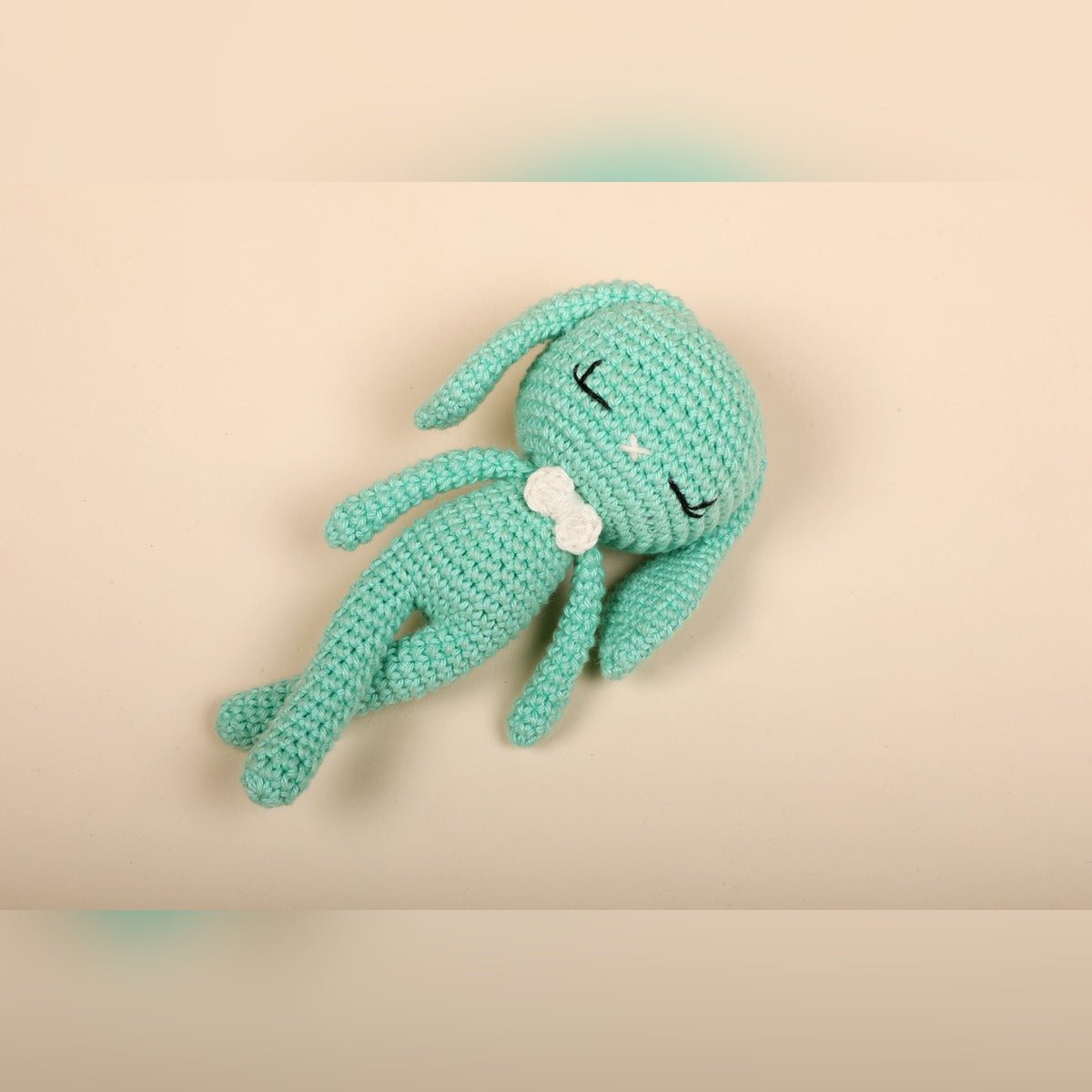 Green Bunny Crochet Baby Doll – Newborn Cuddle Toy – Dolls & Dollhouses by Bombay Toy Company available on Brown Living™. . SKU: CBD01GR. Img 1.