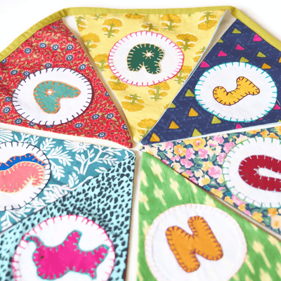 Personalized Name Banner with Animal Motifs (Triangle Flag) – Wall Decor on Brown Living™. SKU: UMW - BUNTING - PRSN - ANML - 01. Img 4.