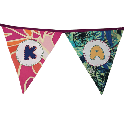 Personalized Name Banner with Cupcake & Flower Motifs (Triangle Flag) – Wall Decor on Brown Living™. SKU: UMW - BUNTING - CPCKFLR - 01. Img 5.
