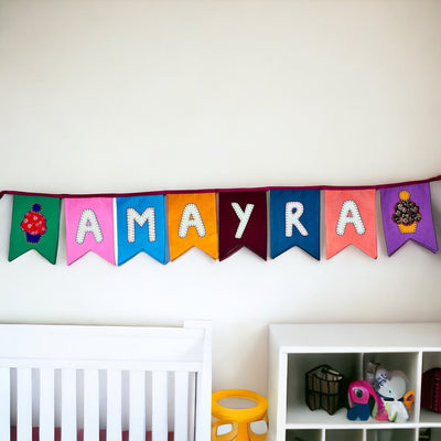 Personalized Name Bunting (Swallowtail Flag) – Wall Decor on Brown Living™. SKU: UMW - BUNTING - PRSN - ST - 01. Img 2.