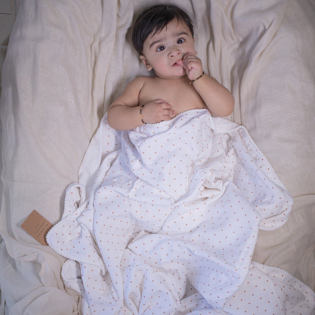 Spottie Dottie Pom Pom Blanket – All Season Organic Baby Blanket | Verified Sustainable by Brown Living™