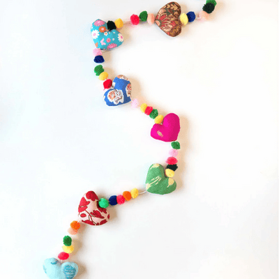 Upcycled Hearty Pom Pom String – Wall Decor on Brown Living™. SKU: UMW - HEART - STRING - 01. Img 4.