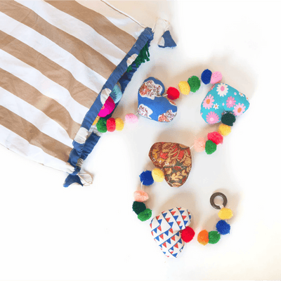 Upcycled Hearty Pom Pom String – Wall Decor on Brown Living™. SKU: UMW - HEART - STRING - 01. Img 2.