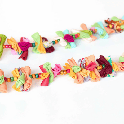 Upcycled Rainbow Rolly Molly String - Party Streamer – Wall Decor on Brown Living™. SKU: UMW - ROLLY - STRING - 01. Img 5.