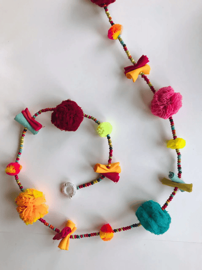 Upcycled Tinker Pom - Pom String – Wall Decor on Brown Living™. SKU: UMW - TINKER - STRING - 01. Img 2.