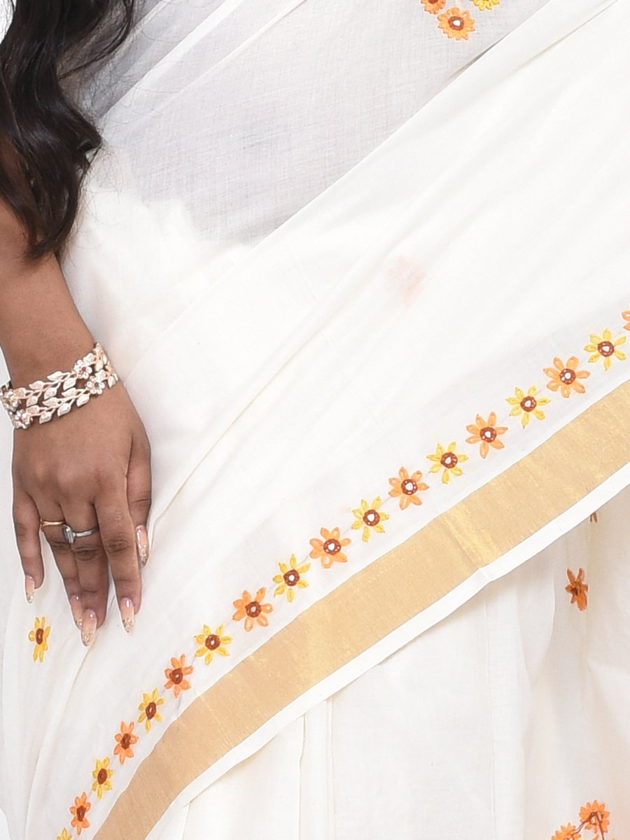 White Kerala Cotton Saree with Floral Hand Embroidery and Zari Border | Verified Sustainable by Brown Living™