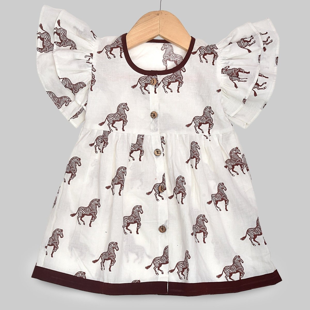 White Printed Cotton Baby Dress with Zebra Design