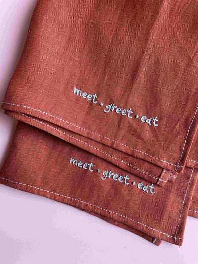 The Greet Sheet - Table Napkin – Table Decor on Brown Living™. SKU: TNMG1. Img 1.