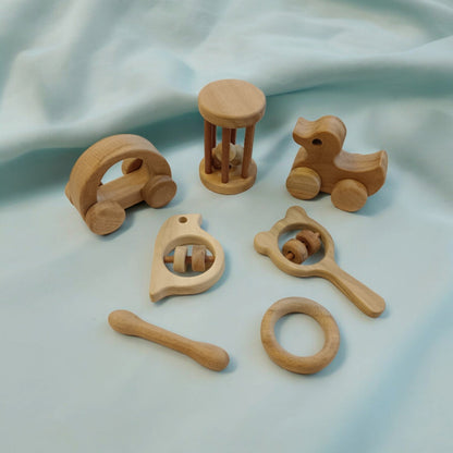 Toddler Toys Neem Wooden Wheel, Rattle & Teether Play Set – Wooden Toys on Brown Living™. SKU: WRT_HCR-DK-TMBLR-MKHD-SPR-DBL-RNG. Img 1.