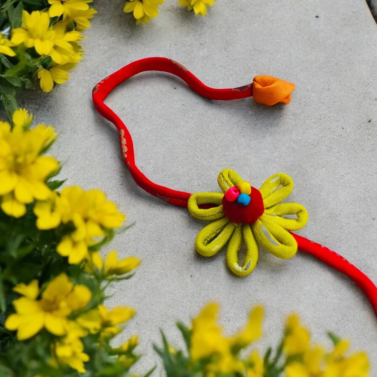 Upcycled Handmade Daizy Love Rakhi – Rakhi by USE ME WORKS available on Brown Living™. . SKU: UMW - Rakhi - 13. Img 1.