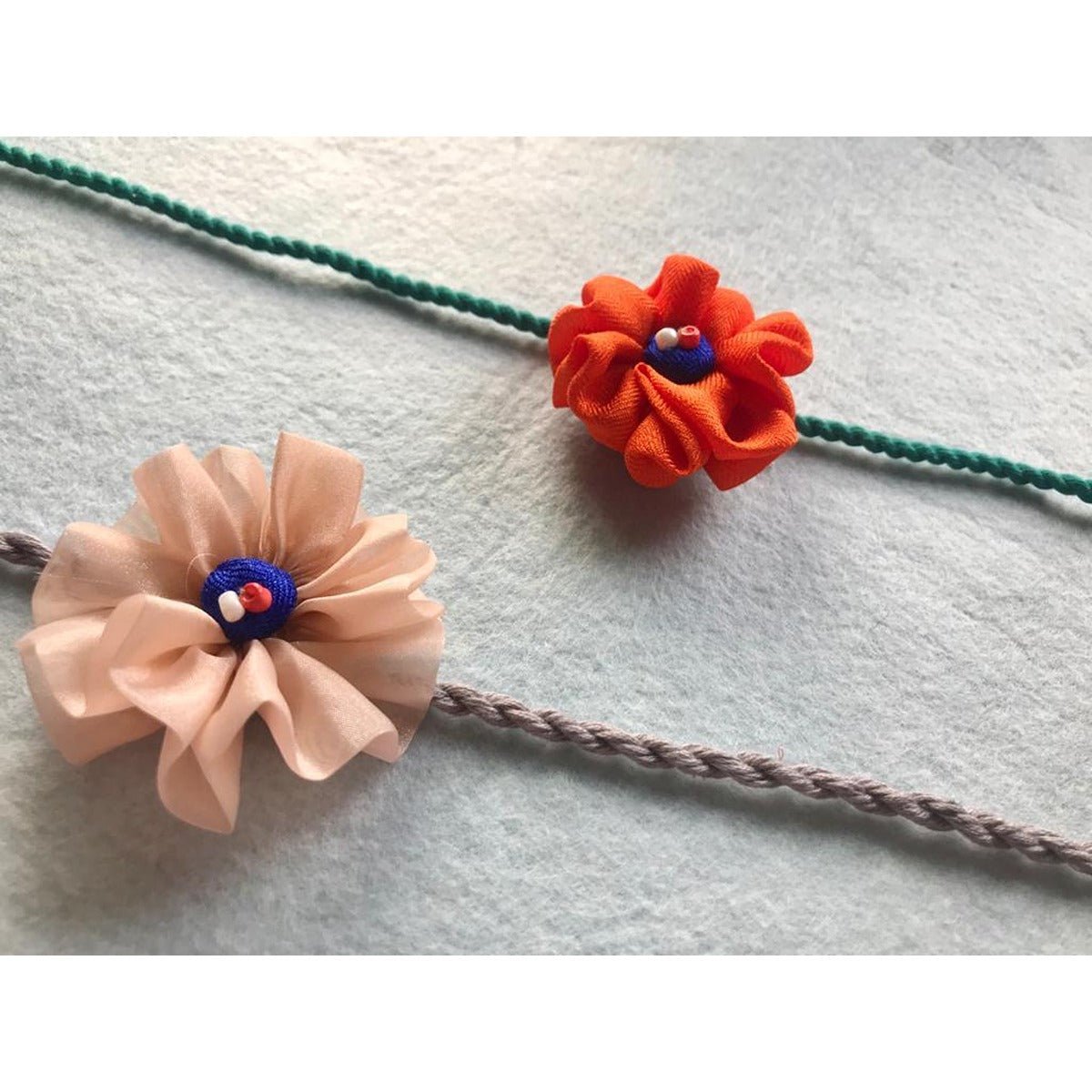 Upcycled Handmade Flower Power Rakhi Combo (Pack of 4) – Rakhi by USE ME WORKS available on Brown Living™. . SKU: UMW - Combo - Rakhi - 06. Img 2.