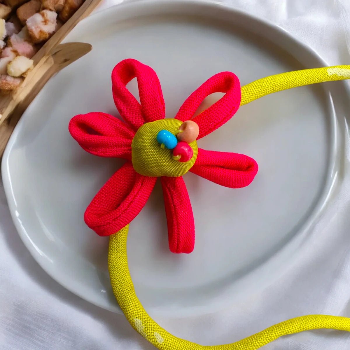 Upcycled Handmade Pink Earth Rakhi – Rakhi by USE ME WORKS available on Brown Living™. . SKU: UMW - Rakhi - 14. Img 1.
