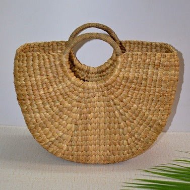 Water Hyacinth Half Moon Basket Bag - Natural – Womens Handbag on Brown Living™. SKU: WHRBAG011A. Img 1.
