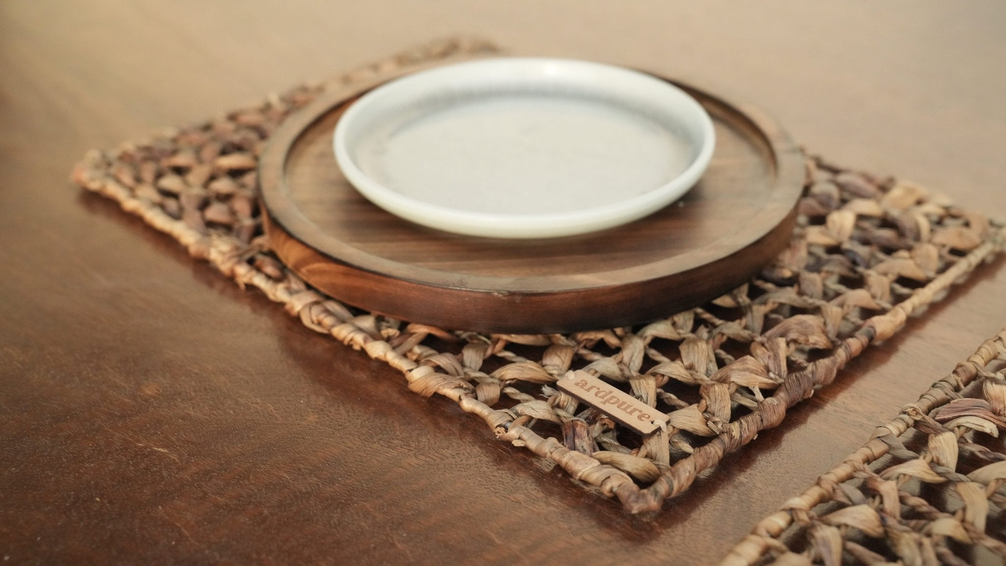 WH Flora Placemat | Handwoven Natural Dining Table Mat (Set of 2) – Baskets & Boxes on Brown Living™. SKU: 811WM. Img 1.