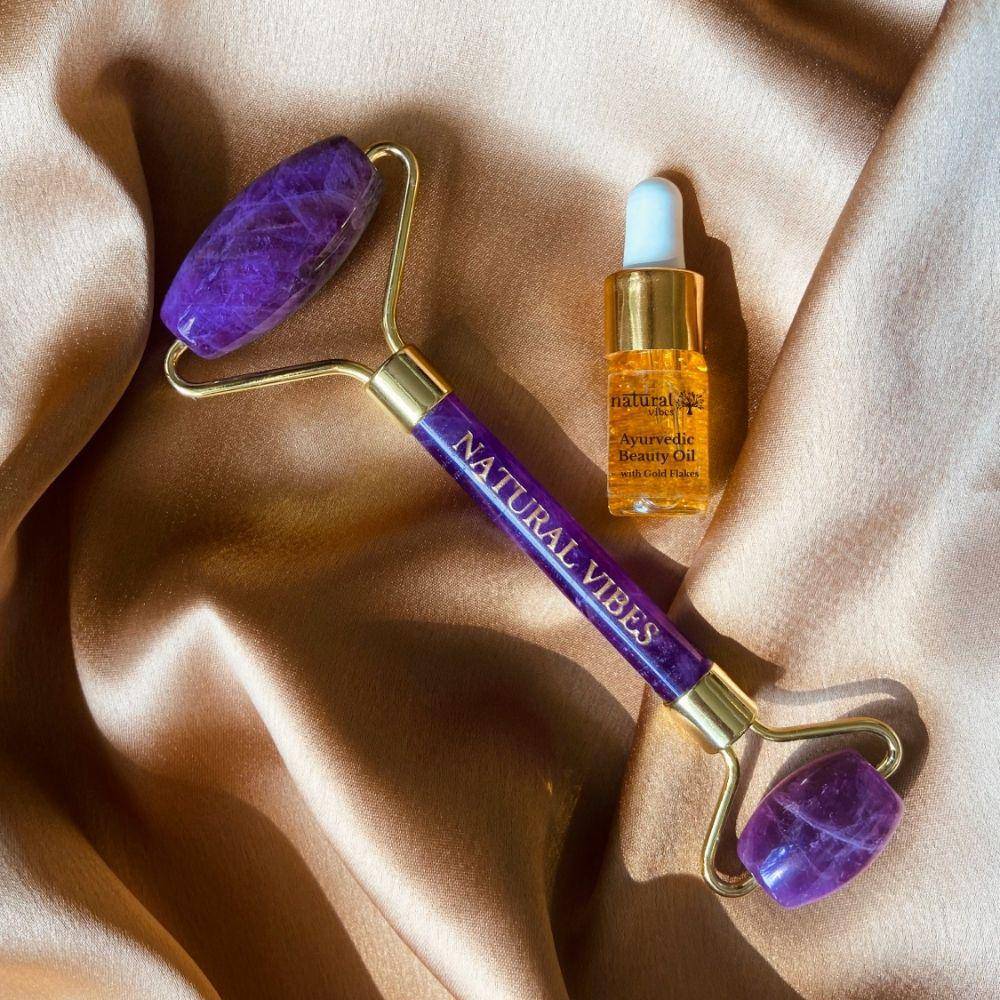 Amethyst Roller & Massager for Face, Neck and Under eye with FREE Gold Beauty Elixir Oil – Massager by Natural Vibes available on Brown Living™. . SKU: 063 - 05467 - NV_Amethyst_Roller_oil. Img 1.