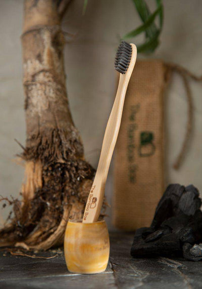Bamboo Toothbrush | Charcoal Bristles – Tooth Brush on Brown Living™. SKU: TBB - 16. Img 1.