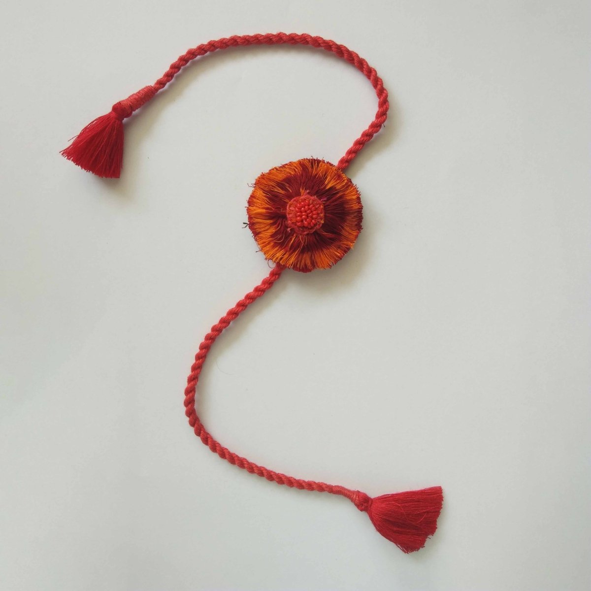 Dual Avtar Ikat Rakhi - Red Orange | Reusable Ikat Rakhi | Verified Sustainable by Brown Living™