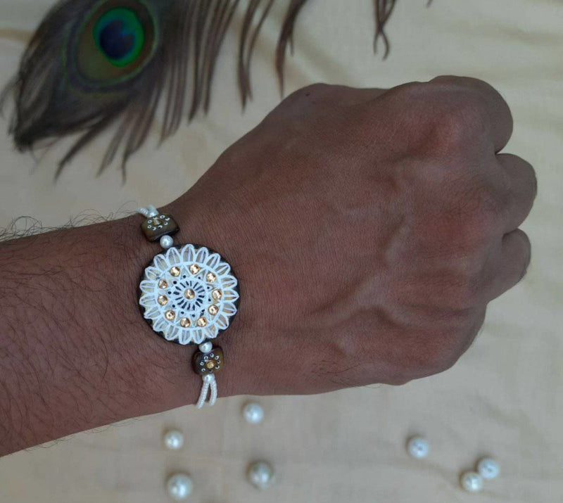 Buy Hand Painted Pearl Shell Rakhi | Shop Verified Sustainable Products on Brown Living