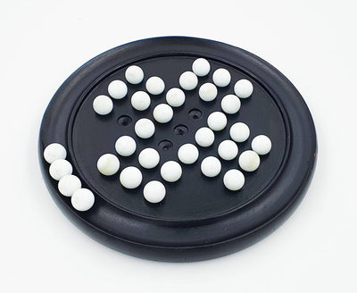 Handmade Wooden Solitaire Board Game with White Glass Marble – Learning & Educational Toys on Brown Living™. SKU: 1007418. Img 4.