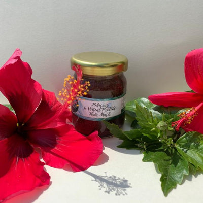 Hibiscus & Wheat Protein Hair Mask – Hair Mask on Brown Living™. SKU: AM1029. Img 1.