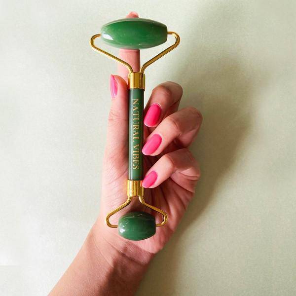 Jade Roller & Massager - Face,Neck&Undereye - FREE Gold Beauty Oil – Massager by Natural Vibes available on Brown Living™. . SKU: 063 - 06400 - NV_Jade_Green_Roller_oil. Img 1.