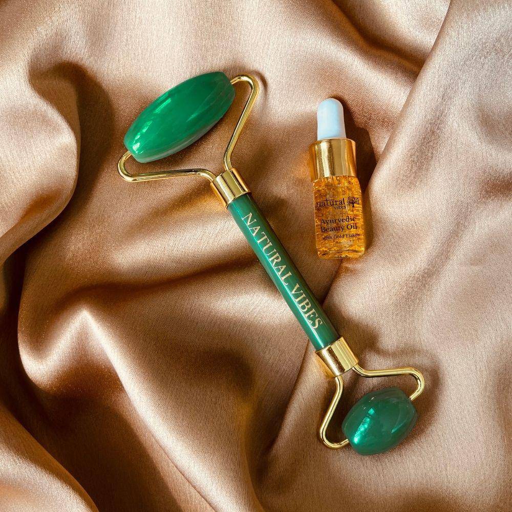 Jade Roller & Massager with FREE Gold Beauty Elixir Oil – Massager by Natural Vibes available on Brown Living™. . SKU: 063 - 05469 - NV_Jade_Green_Roller_oil. Img 1.