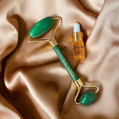 Jade Roller & Massager with FREE Gold Beauty Elixir Oil – Massager by Natural Vibes available on Brown Living™. . SKU: 063 - 05469 - NV_Jade_Green_Roller_oil. Img 1.
