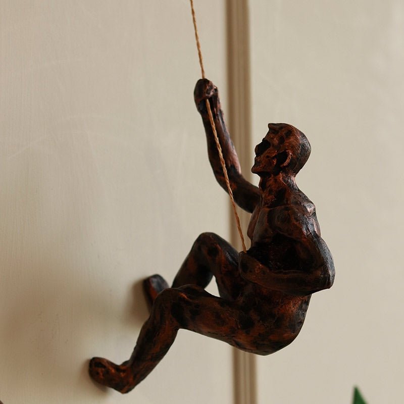 Resin Hanging Man Figurines - Golden – Wall Decor on Brown Living™. SKU: 347514. Img 2.