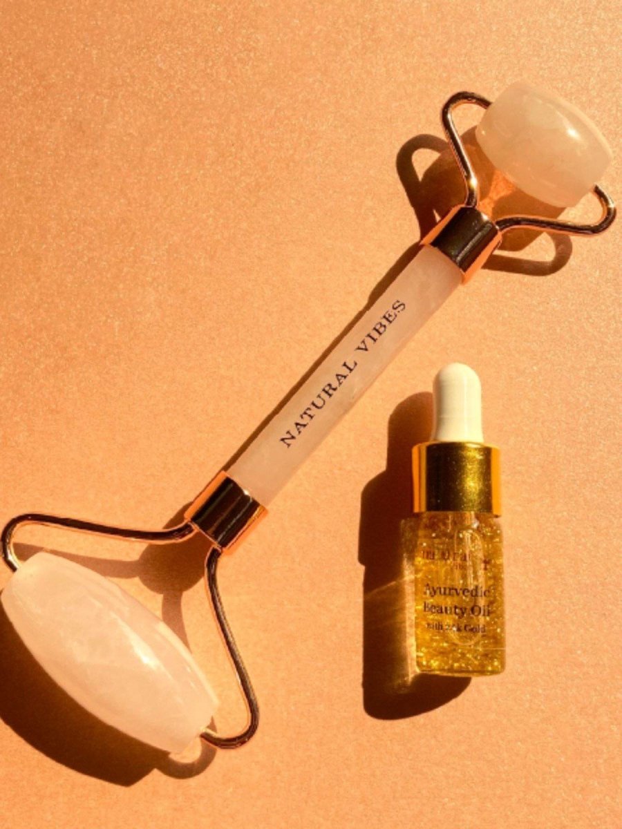 Rose Quartz Roller & Massager for Face, Neck and Under eye with FREE Gold Beauty Oil – Massager by Natural Vibes available on Brown Living™. . SKU: 063 - 05428 - NV_Rose_Quartz_Roller_oil. Img 1.