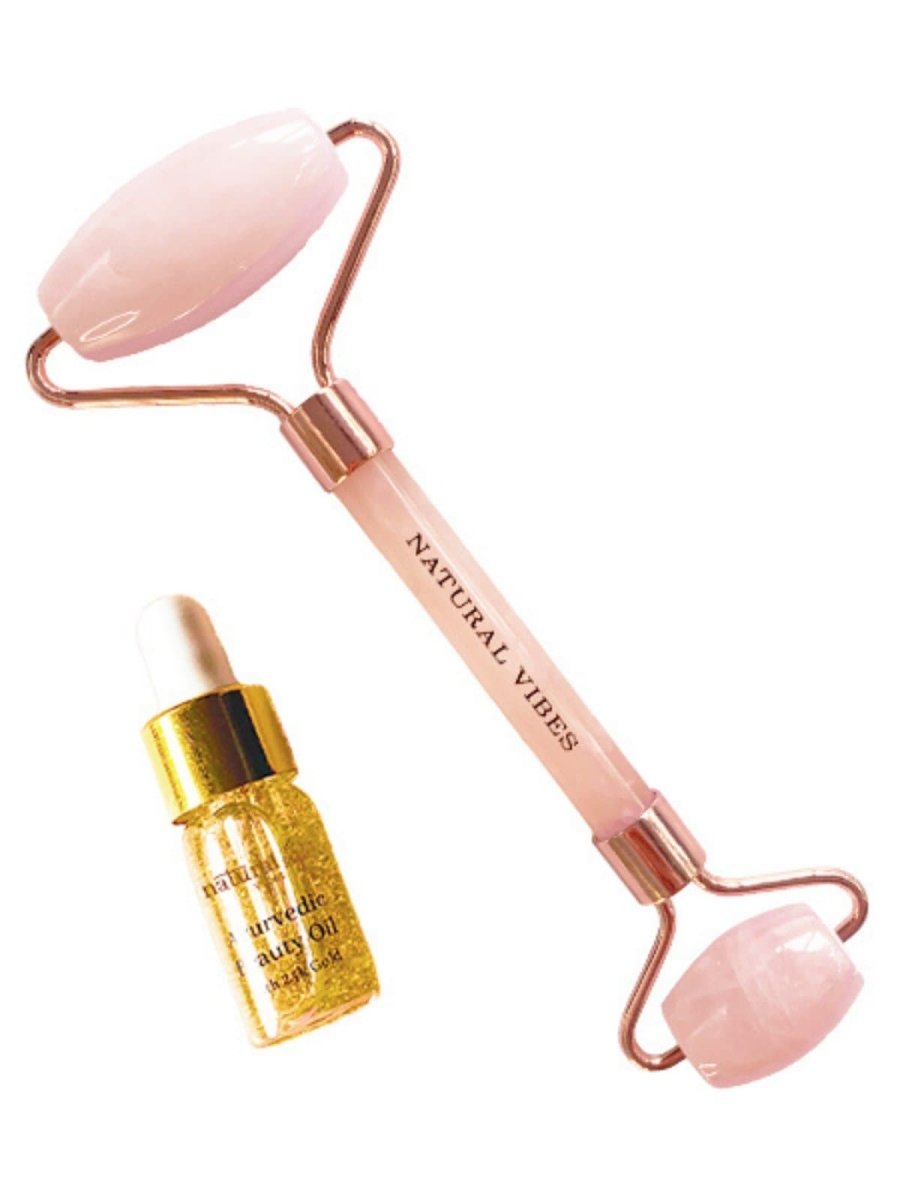 Rose Quartz Roller & Massager for Face, Neck and Under eye with FREE Gold Beauty Oil – Massager by Natural Vibes available on Brown Living™. . SKU: 063 - 05428 - NV_Rose_Quartz_Roller_oil. Img 3.