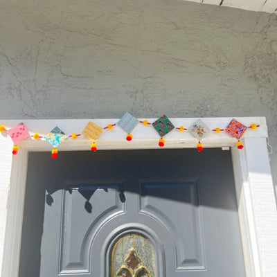 Upcycled Cotton and Newsaper Toran – Wall Decor on Brown Living™. SKU: GRTRN02. Img 3.